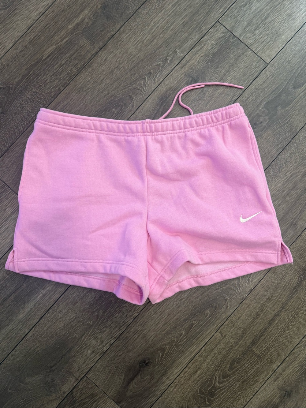 Nike Women’s Light Pink Athletic Shorts with White Swoosh